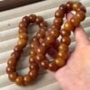 CARAMEL CLOVE bracelet with glossy 16mm garlic-clove-shaped Bodhi beads in warm golden and caramel-brown tones